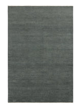 Armadillo Thatch Rug in Orca, a second view of the hand-knotted wool rug in a styled interior