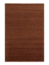 Armadillo Thatch Rug in Copper, overhead view of the hand-knotted wool weave and edge finish