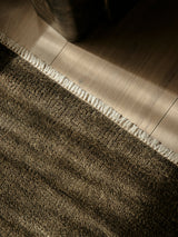 Armadillo Thatch Rug in Gumnut, a second view of the hand-knotted wool rug in a styled interior