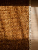 Armadillo Thatch Rug in Maize, a second view of the hand-knotted wool rug in a styled interior