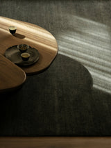 Armadillo Thatch Rug in Orca, hand-knotted wool rug shown in a room setting