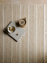 Armadillo Trellis Rug in Natural & White, a second view of the handwoven wool and jute rug in a styled interior