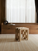 Armadillo Trellis Rug in Natural & Sandstone, handwoven wool and jute rug shown in a room setting