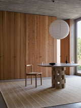Armadillo Trellis Rug in Natural & White, handwoven wool and jute rug shown in a room setting