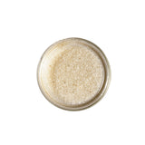 Calicutts Vanilla Bean Sugar Blend with visible specks of Madagascar bourbon vanilla in a glass jar, top view.