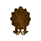 Vintage brass shell wall candle sconce holding two taper candles — white background