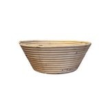 Collected by Schwung vintage woven natural fiber bread proofing basket with a rustic coiled design