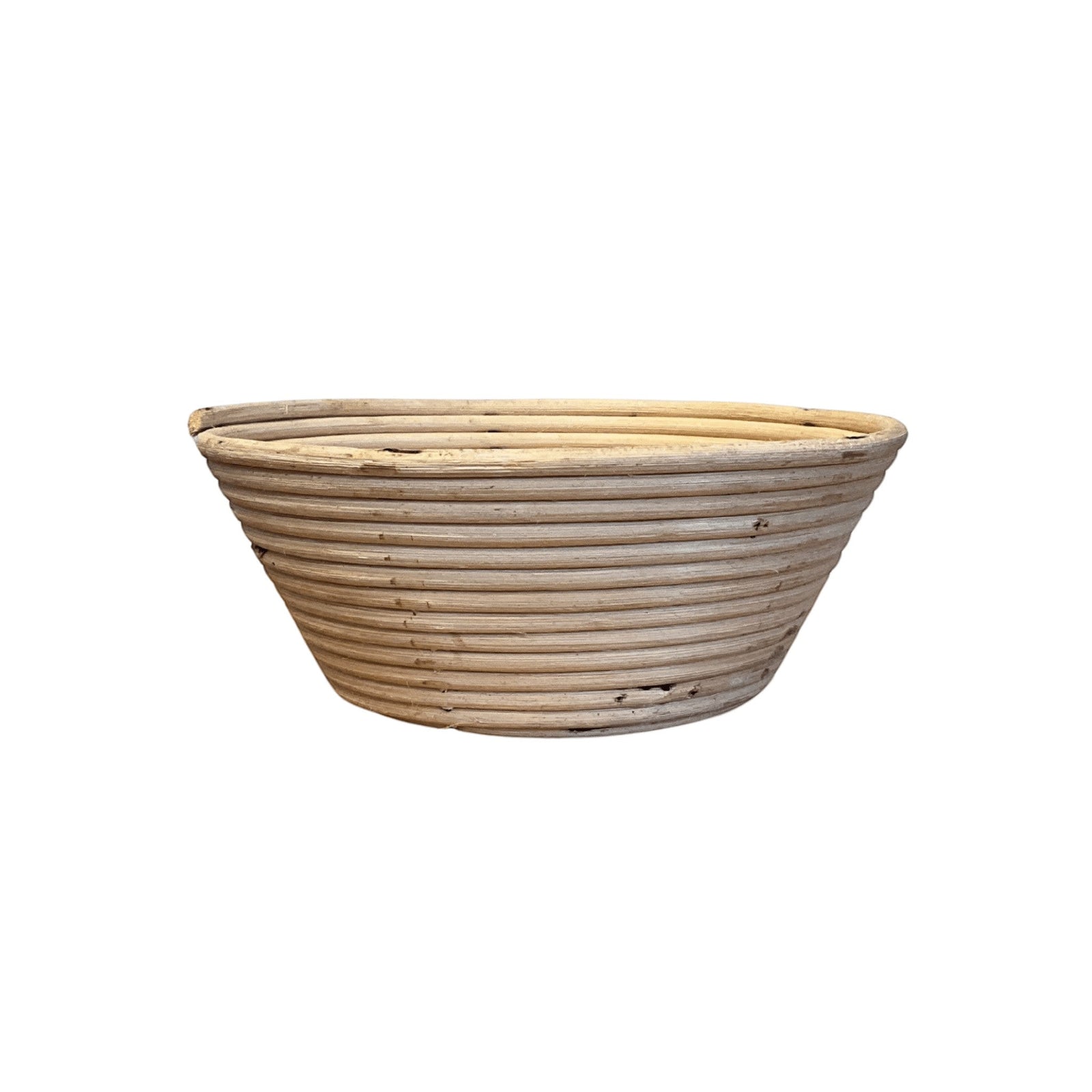 Collected by Schwung vintage woven natural fiber bread proofing basket with a rustic coiled design