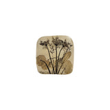 Vintage ceramic botanical wall tile with Queen Anne's lace and scalloped geranium leaves pressed into speckled cream stoneware, signed by the maker