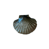 Calimia Home ceramic scallop shell trinket dish in a glossy dark earth-toned glaze with ribbed detailing.