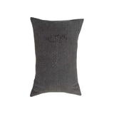 Wildflower Charcoal Lumbar Pillow by One Bi One — hand-embroidered wool wildflower motif on Belgian linen in deep charcoal, handcrafted in Gothenburg, Sweden