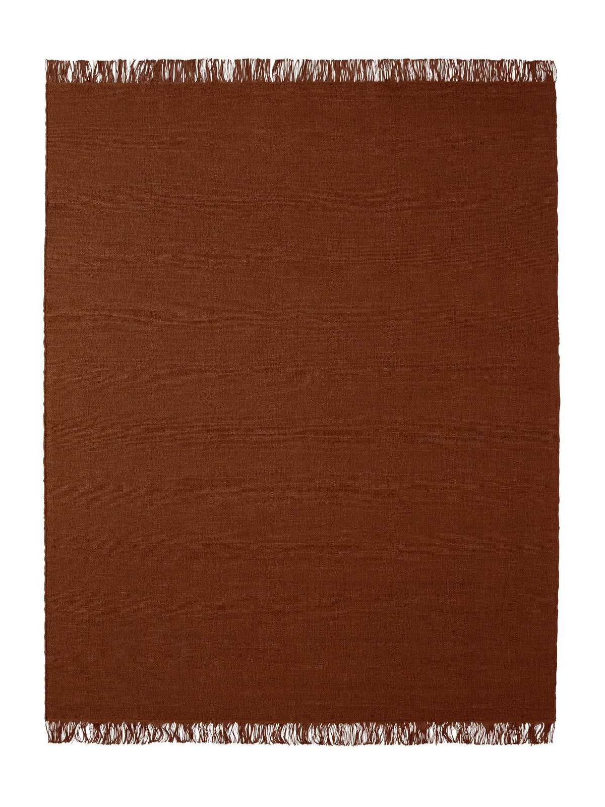 Armadillo Willow Rug in Henna, a second view of the handwoven flatweave rug in a styled interior