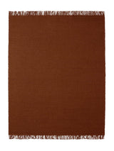 Armadillo Willow Rug in Henna, a second view of the handwoven flatweave rug in a styled interior