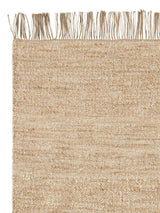Armadillo Willow Rug in Eggshell, corner close-up of the linen, wool, and jute pile and edge
