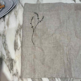 Willow Stitch Apron by One Bi One — embroidered Belgian linen in oatmeal, adjustable ties, handcrafted in Gothenburg, Sweden