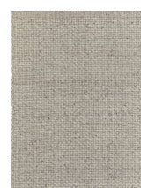 Armadillo Winnow Rug in Granite, corner close-up of the wool pile and edge