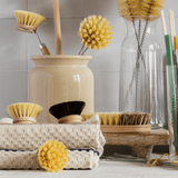 Earth & Nest wooden dish brushes styled by a kitchen sink