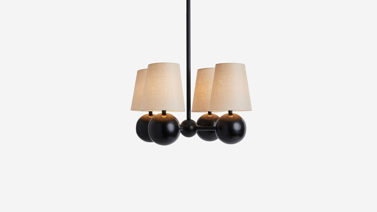 Workstead Bole Pendant IV with Natural Linen shade, illuminated