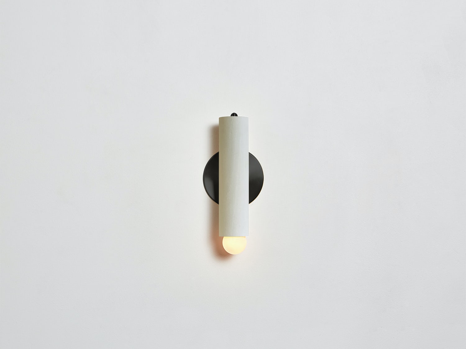 Workstead Lodge Sconce in Painted White with Blackened Brass hardware, illuminated