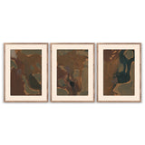 Worn Triptych by Brooke Noel Morgan — three-panel abstract canvas wall art in olive and brown tones, framed in rustic walnut, shown on a white wall