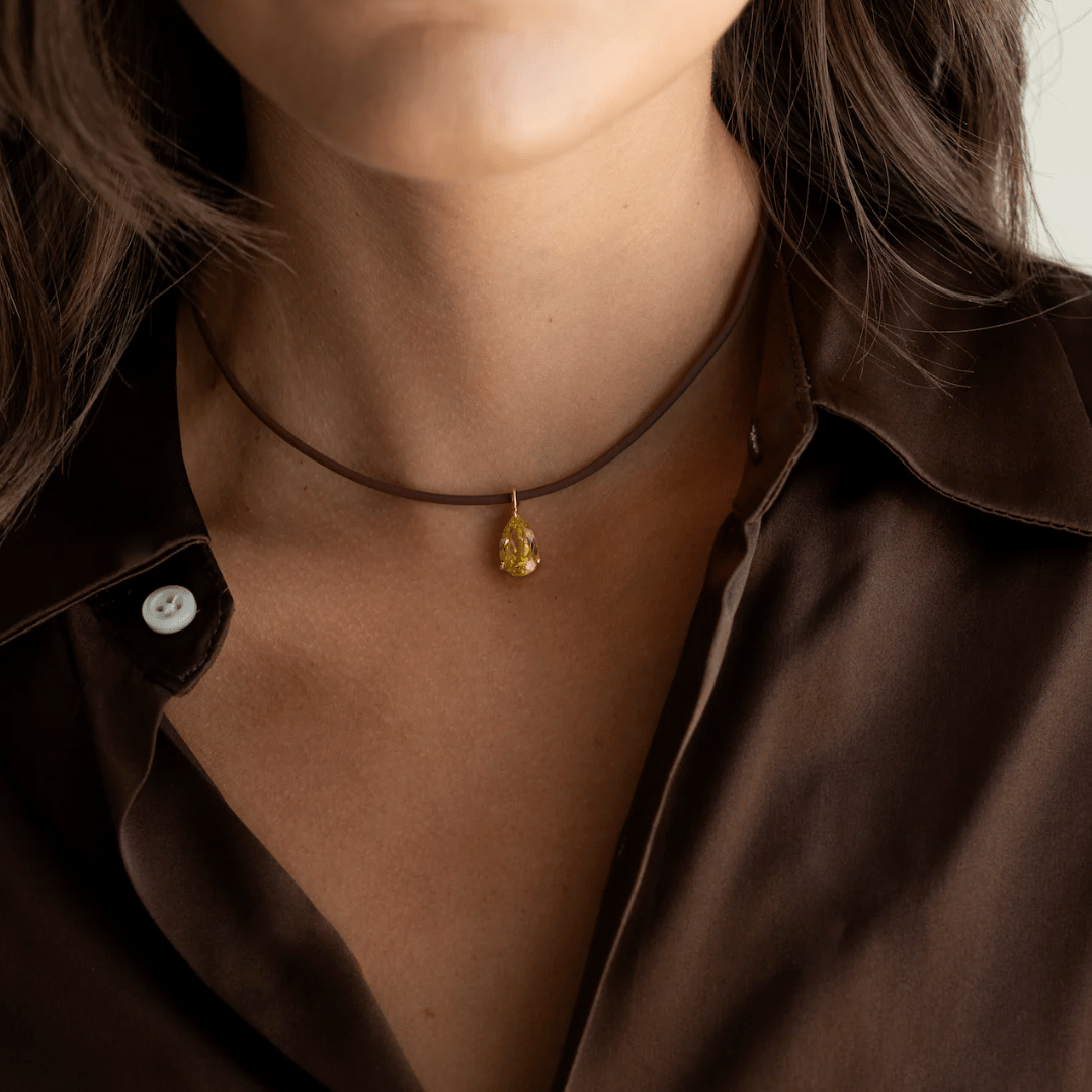 Close-up view of yellow pear pendant