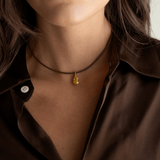Close-up view of yellow pear pendant