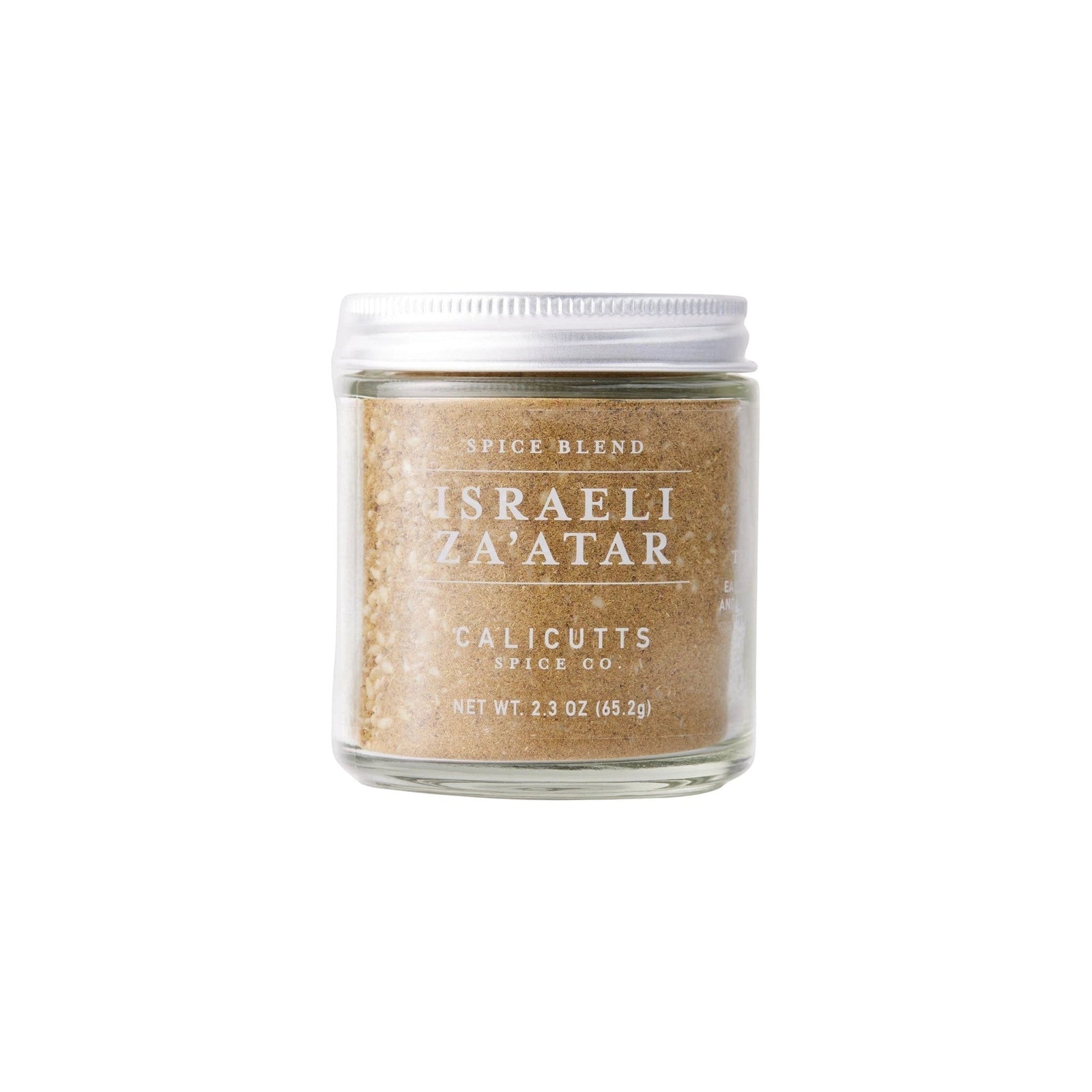 Calicutts Israeli Za'atar spice blend in a clear glass jar with a white lid, featuring thyme, sesame, and sumac.