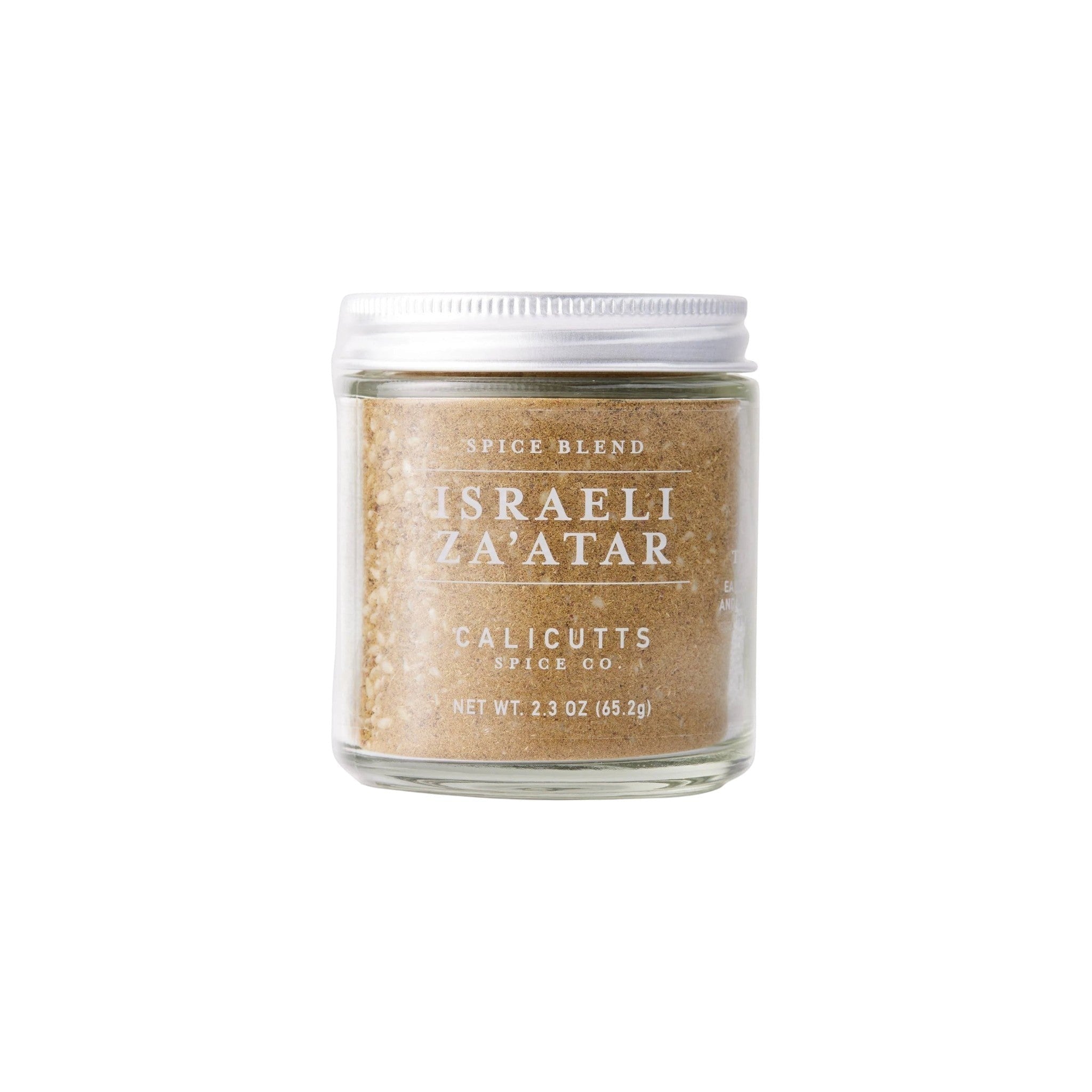 Calicutts Israeli Za'atar spice blend in a clear glass jar with a white lid, featuring thyme, sesame, and sumac.