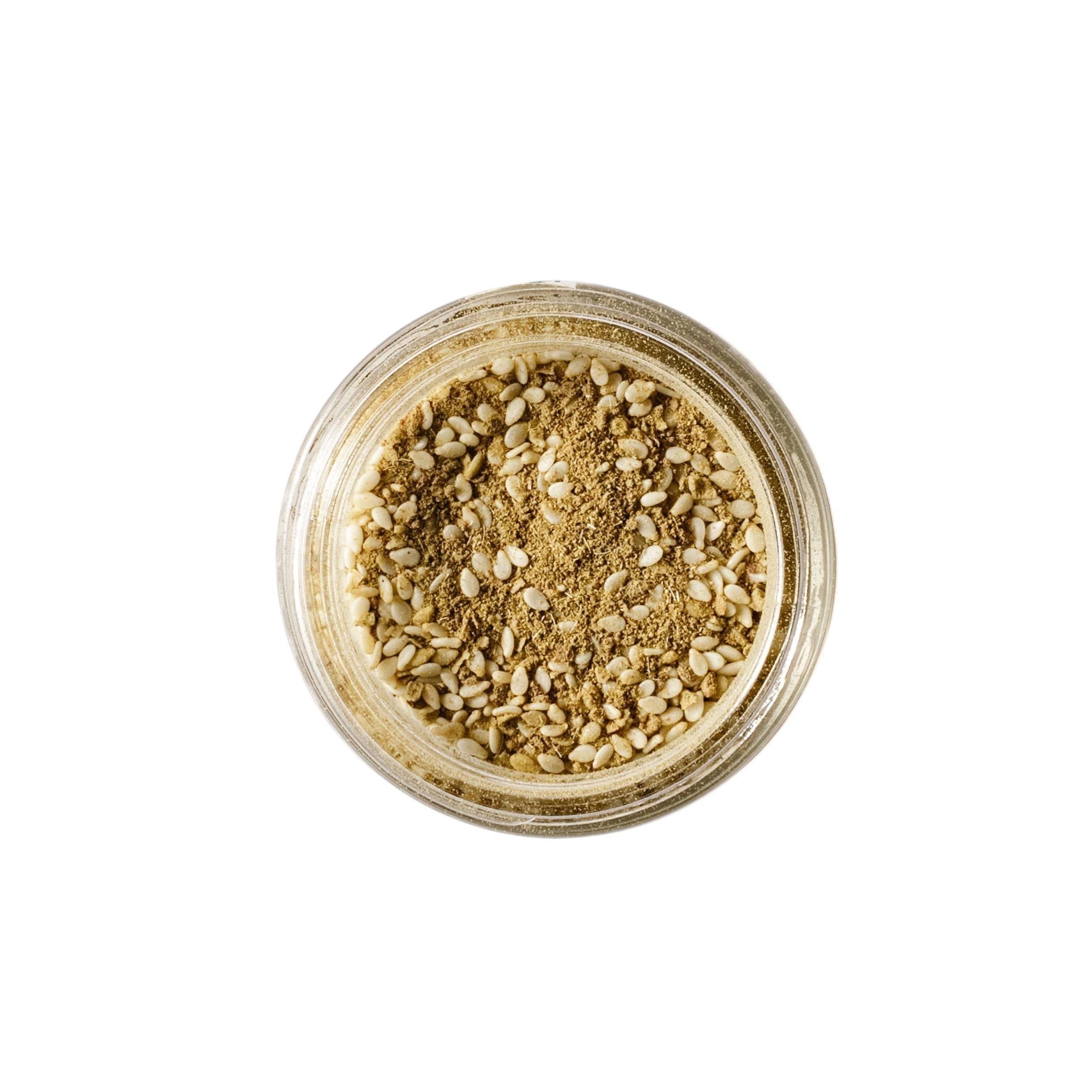 Calicutts Za'atar spice blend in a glass jar, featuring a mix of ground thyme, sumac, and toasted sesame seeds.